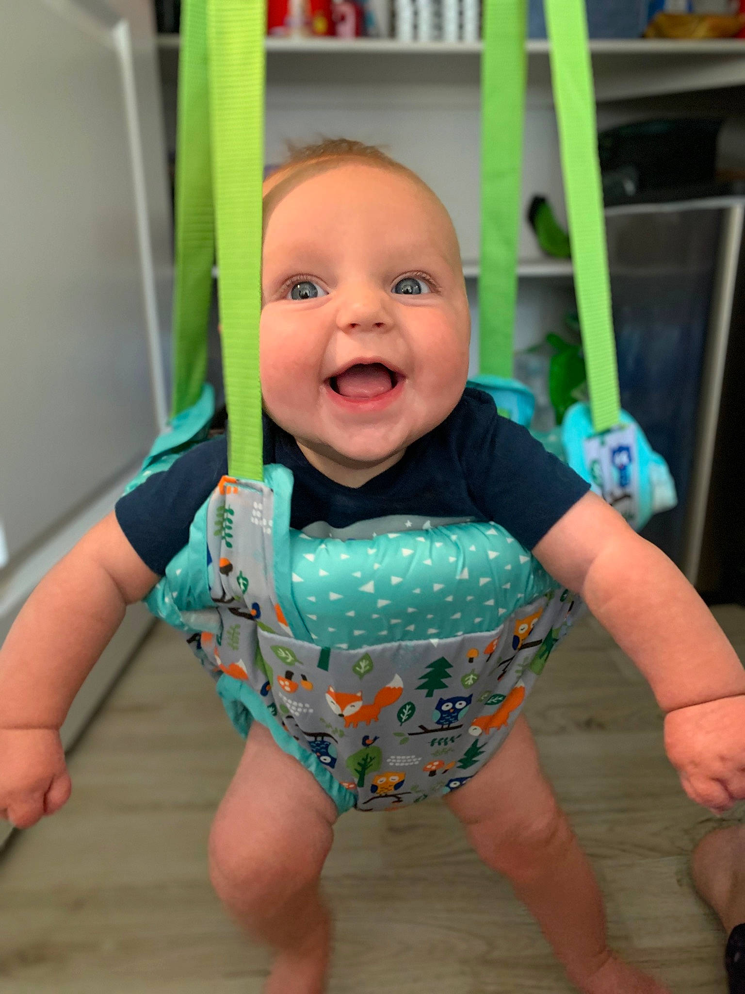 Cade is registered to the contest to win money with this photo: baby, baby_toddler_clothing, cheek, child, chin, flooring, fun, green, happy, head, iris, joint, leg, person, product, sleeve, smile, standing, t_shirt, toddler