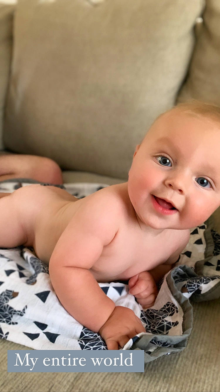 Cade is registered to the contest to win money with this photo: abdomen, baby, baby_toddler_clothing, cheek, chest, child, eyelash, flash_photography, flooring, happy, human_leg, lip, nose, person, skin, smile, stomach, thumb, toddler, trunk