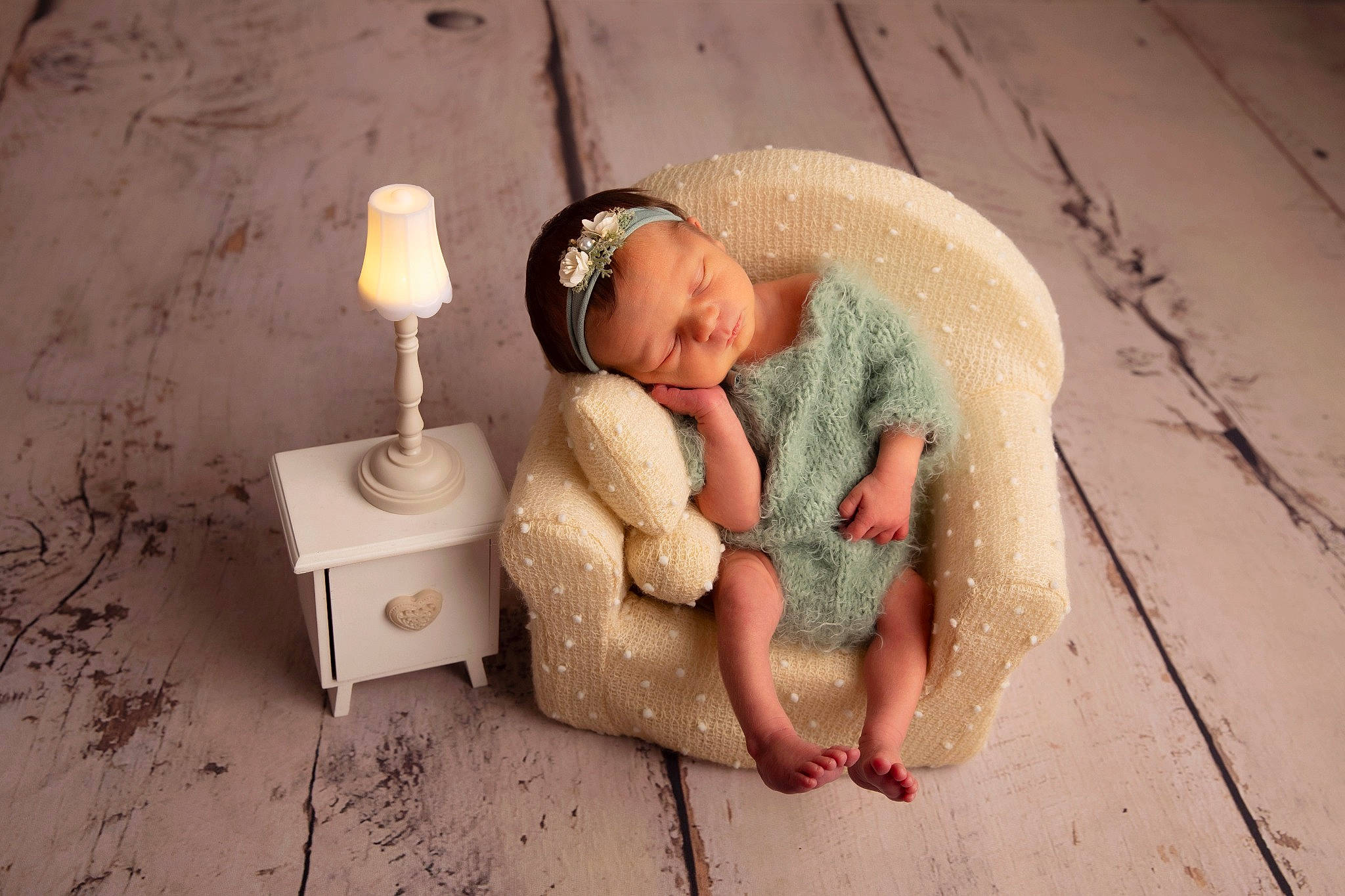 Phoebe is registered to the contest to win money with this photo: baby, barefoot, candle, cap, comfort, fashion_accessory, flash_photography, floor, flooring, foot, fun, fur, grass, hardwood, lamp, linens, person, room, sitting, toy