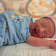 Torbin is registered to the contest to win money with this photo: newborn, baby, sleeping, blanket, hat, infant, pillow, resting, cute, soft, patterned_blanket, striped_hat, peaceful, indoors, closeup, skin, face, hand, wrapped, cozy