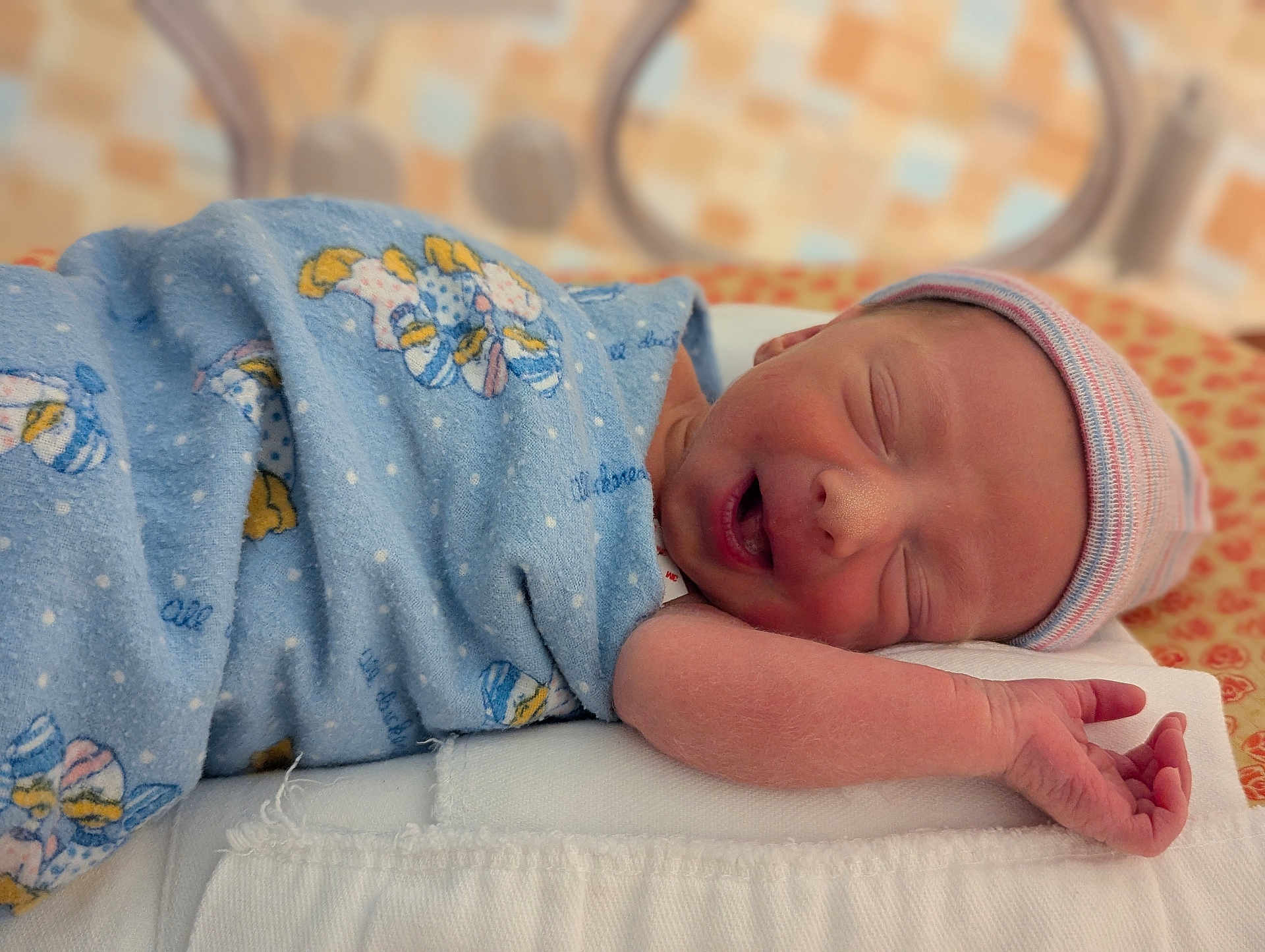 Torbin is registered to the contest to win money with this photo: newborn, baby, sleeping, blanket, hat, infant, pillow, resting, cute, soft, patterned_blanket, striped_hat, peaceful, indoors, closeup, skin, face, hand, wrapped, cozy