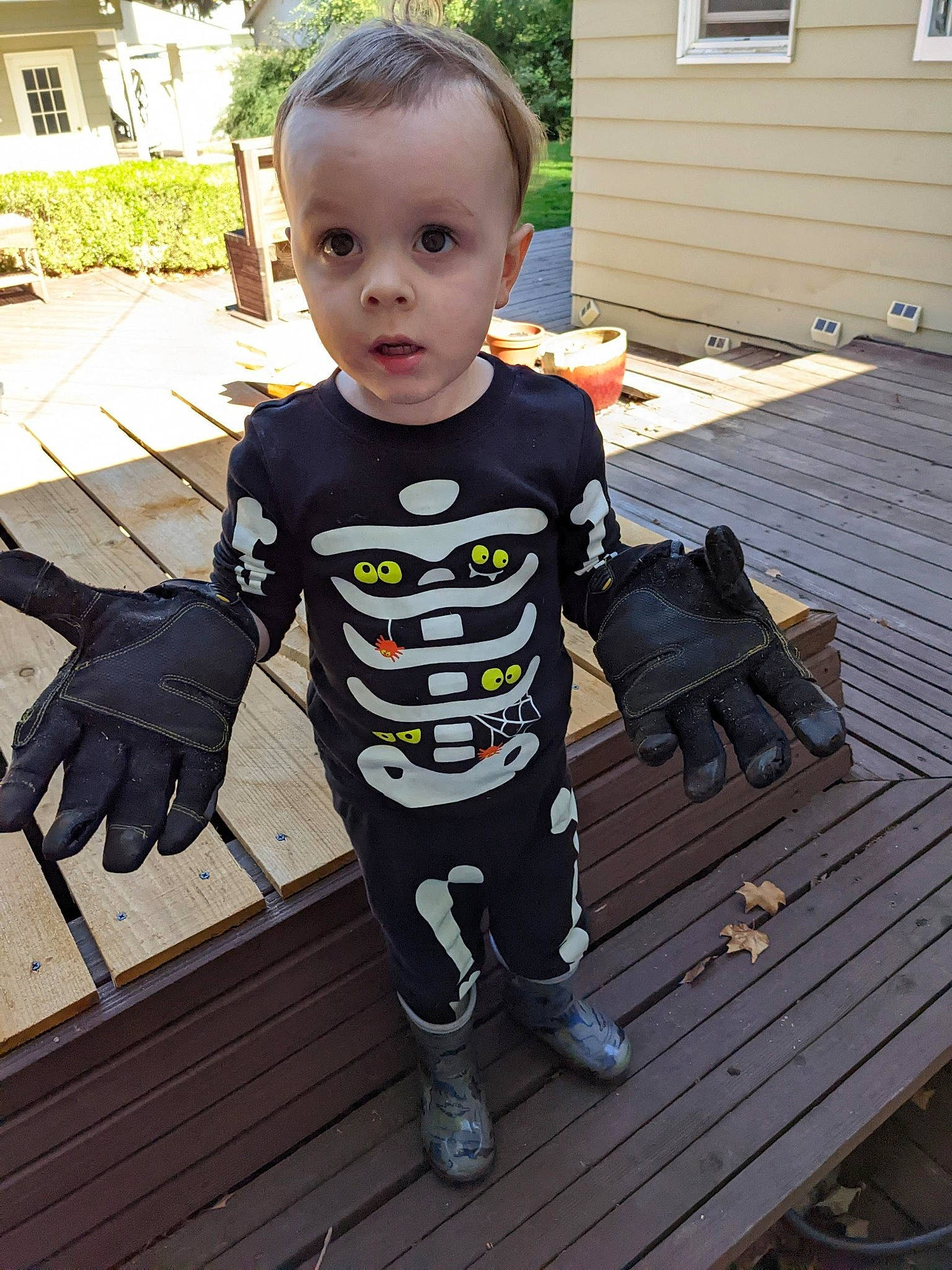 Greyson joined the competition — help win amazing prizes! baby, baby_toddler_clothing, child, door, flooring, grass, happy, hardwood, house, person, personal_protective_equipment, plant, shoe, sitting, sleeve, surprise, t_shirt, toddler, tree, window