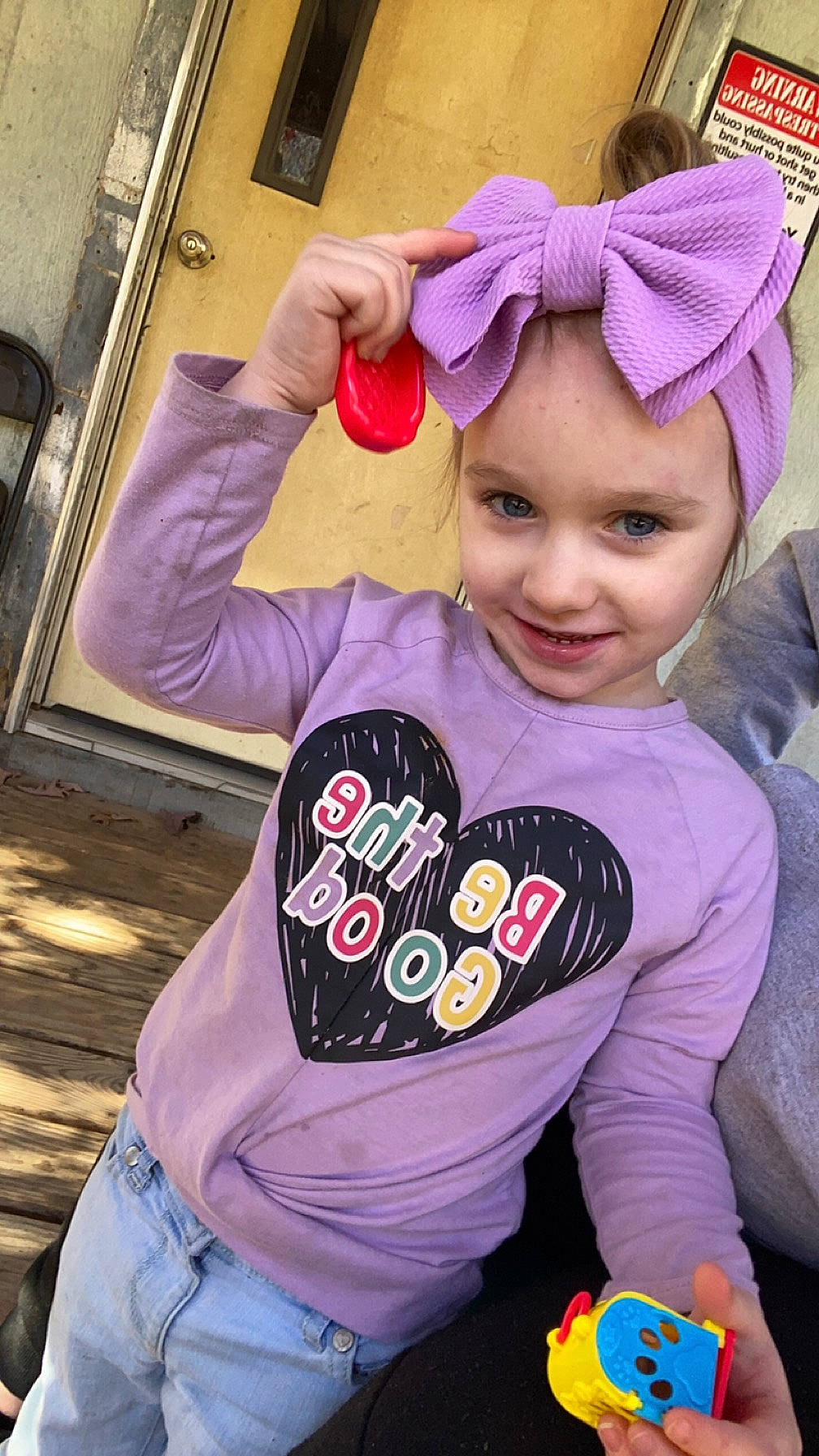 Cheyenne joined the competition — help win amazing prizes! baby_toddler_clothing, beanie, cap, cheek, child, cool, fashion_accessory, fun, happy, headwear, hood, jeans, joy, magenta, mouth, person, pink, purple, sitting, sleeve