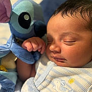 Khaza joined the competition — help win amazing prizes! baby, sleeping, plush_toy, stuffed_animal, blue, pajamas, blanket, closeup, infant, peaceful, cute, child, soft, nap, face, hand, indoors, cozy, portrait, newborn