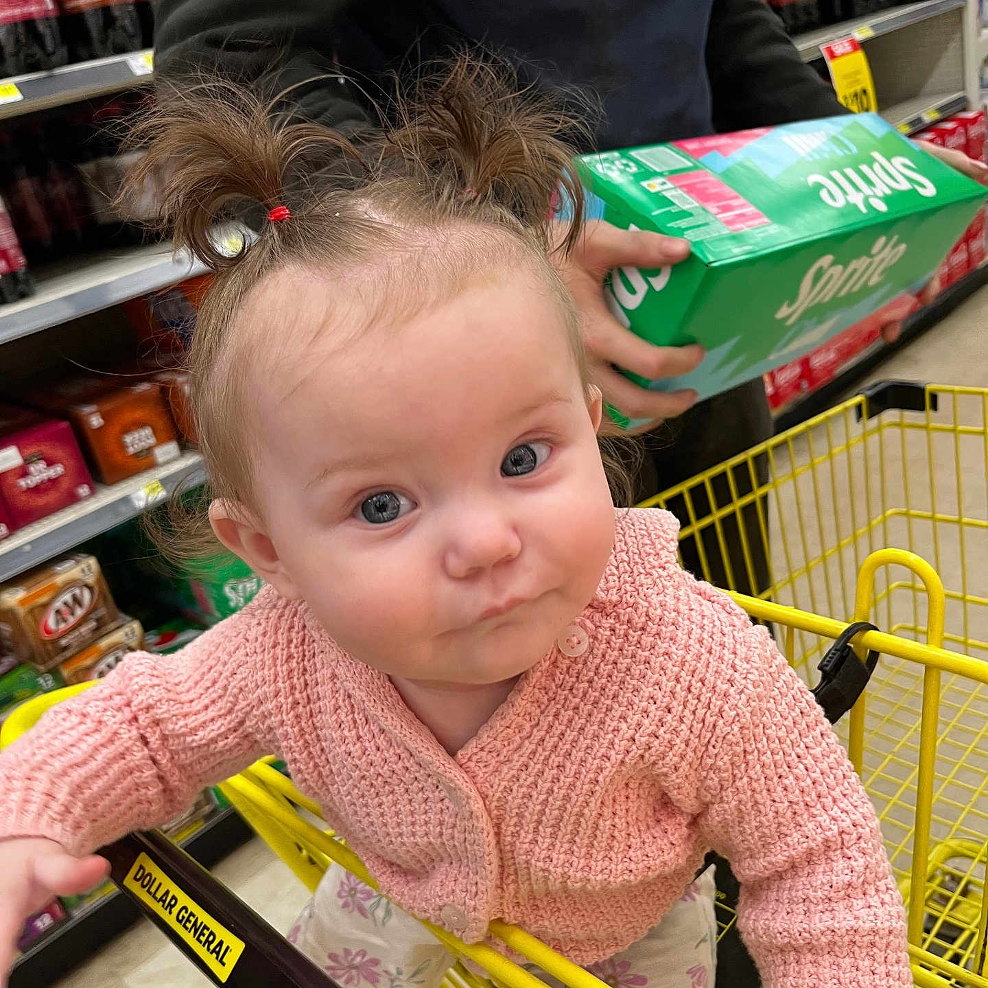 Ivy is registered to the contest to win money with this photo: baby, bodypart, box, clothing, face, finger, food, grocerystore, hand, head, indoors, knitwear, market, person, photography, portrait, shelf, shop, sweater, sweets