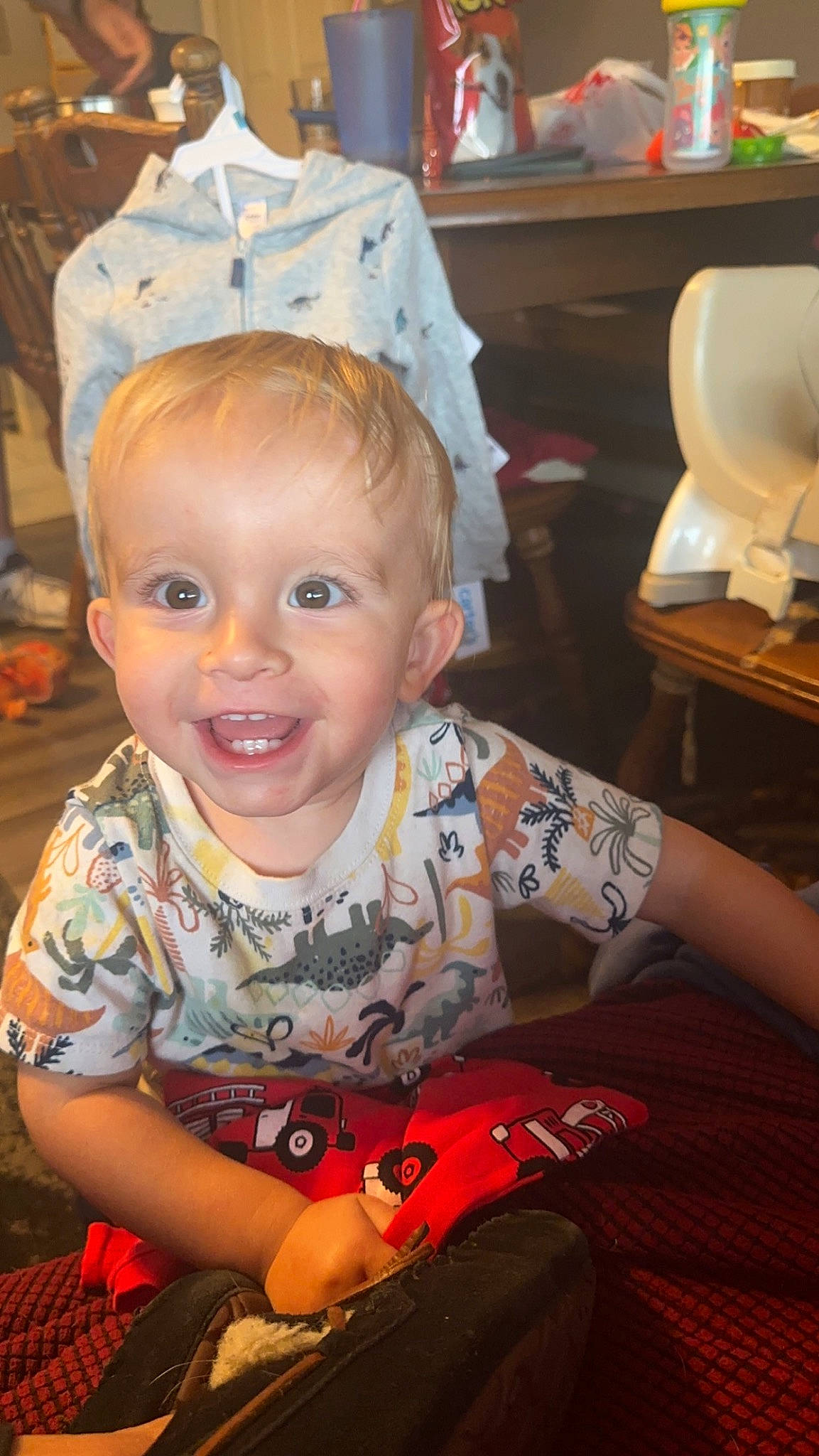 Carter joined the competition — help win amazing prizes! baby, baby_toddler_clothing, chair, cheek, child, event, facial_expression, flooring, fun, happy, head, iris, joy, person, room, sitting, skin, smile, t_shirt, toddler