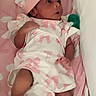 baby, infant, newborn, pink, white, hat, socks, blanket, heart_pattern, clothing, cute, lying_down, portrait, child, soft, bed, resting, indoors, small, person