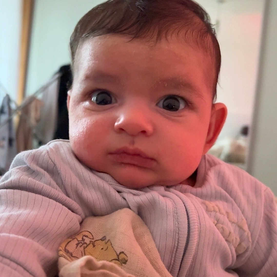 Elion joined the competition — help win amazing prizes! animal_print, baby, blanket, child, closeup, clothing, cozy, curious, cute, expression, eyes, face, indoors, infant, person, portrait, sitting, soft_light, warm, young