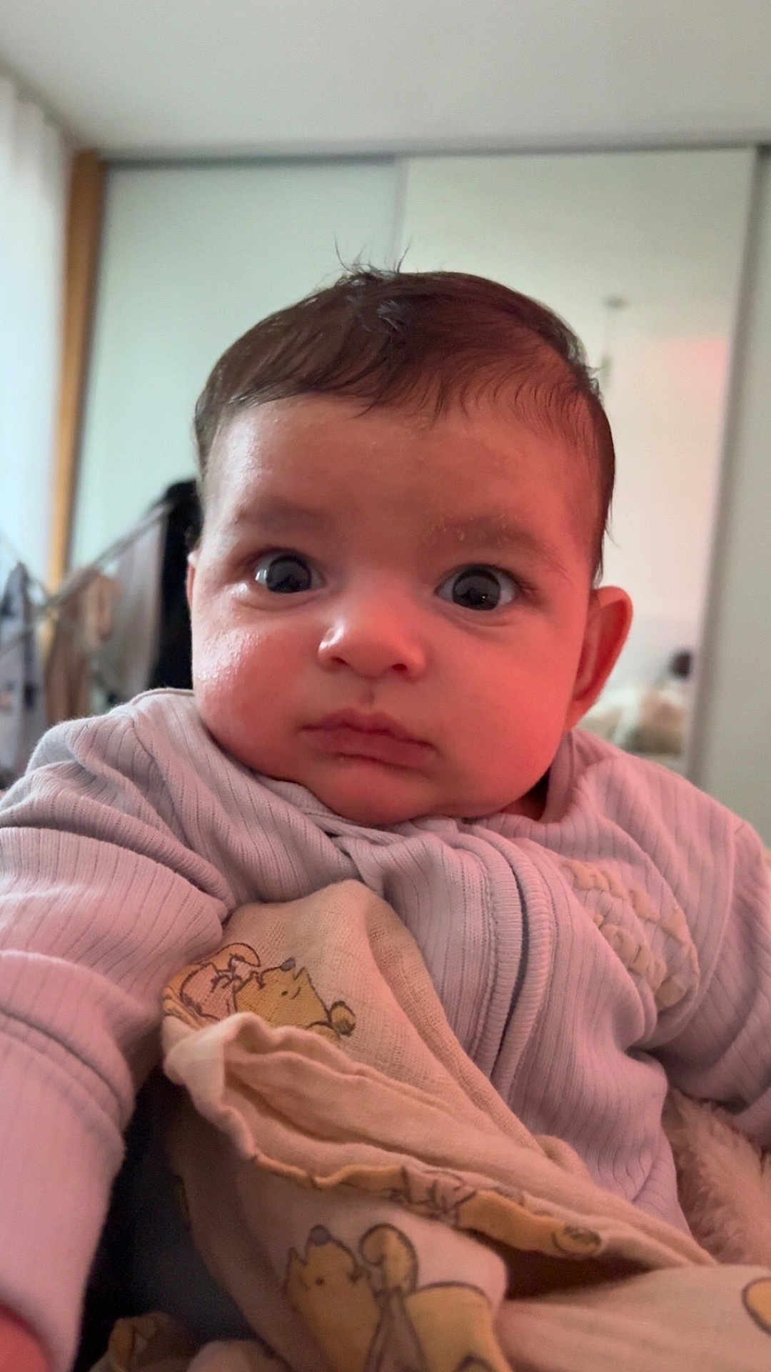 Elion joined the competition — help win amazing prizes! baby, infant, face, eyes, expression, blanket, animal_print, clothing, indoors, portrait, child, cute, warm, cozy, young, person, sitting, soft_light, curious, closeup