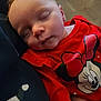 apparel, baby, cartoon_character, child, closeup, cozy, cute, face, head, human, indoors, infant, minnie_mouse, portrait, red_clothing, resting, sleep, sleeping, soft_light, young_child