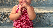 Wrenlee joined the competition — help win amazing prizes! baby, child, toddler, smiling, headband, bow, pink_clothing, sitting, steps, concrete, outdoor, cute, portrait, happy, skin, face, hands, legs, blue_eyes, playful