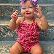 Wrenlee is registered to the contest to win money with this photo: baby, blue_eyes, bow, casual, child, cute, hands, happy, headband, outdoor, pink_clothing, playful, portrait, sitting, skin, smiling, steps, summer, toddler, young_child