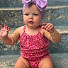Wrenlee is registered to the contest to win money with this photo: toddler, child, baby, headband, bow, purple, red, floral, sitting, steps, outdoor, curious, hands, expression, skin, person, young, casual, summer, portrait