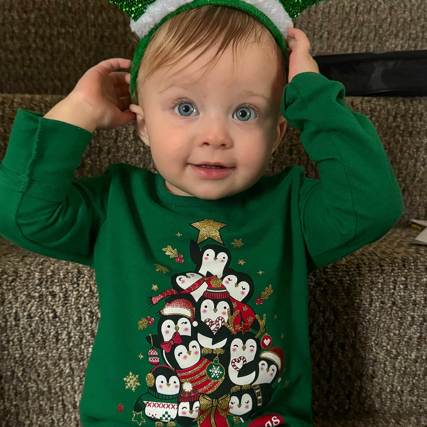 Adalyn is registered to the contest to win money with this photo: applique, baby, bodypart, clothing, couch, face, finger, furniture, hand, hat, head, knitwear, longsleeve, pattern, person, photography, portrait, sleeve, sweater, t_shirt