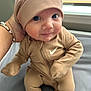 Jaxson J is registered to the contest to win money with this photo: baby, infant, child, person, face, eyes, hat, clothing, onesie, hand, indoor, window, natural_light, skin, portrait, cute, smile, sitting, soft, cozy