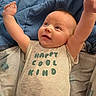 Wren is registered to the contest to win money with this photo: baby, infant, child, smiling, happy, portrait, lying_down, raised_arms, onesie, clothing, blanket, bedding, blue, cozy, indoors, face, eyes, head, baby_bed, cute