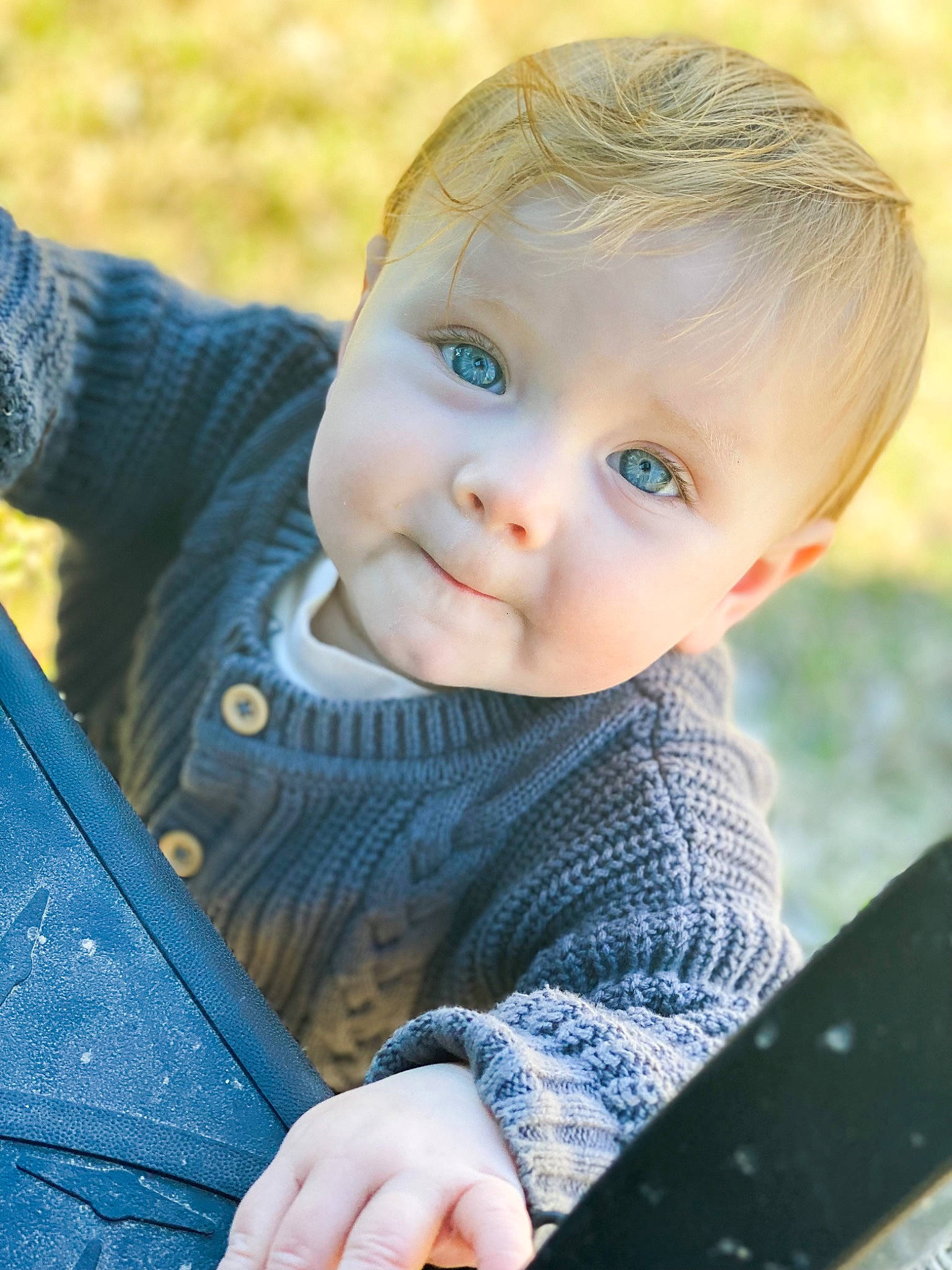 Briar is registered to the contest to win money with this photo: azure, baby, baby_toddler_clothing, blue, cheek, flash_photography, grass, hair, happy, iris, lip, nose, outerwear, person, plant, skin, sleeve, smile, toddler, tree