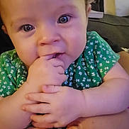 Skylar joined the competition — help win amazing prizes! accessories, baby, bodypart, clothing, couch, face, finger, furniture, hand, happy, head, indoors, laughing, mouth, newborn, person, photography, portrait, smile, t_shirt