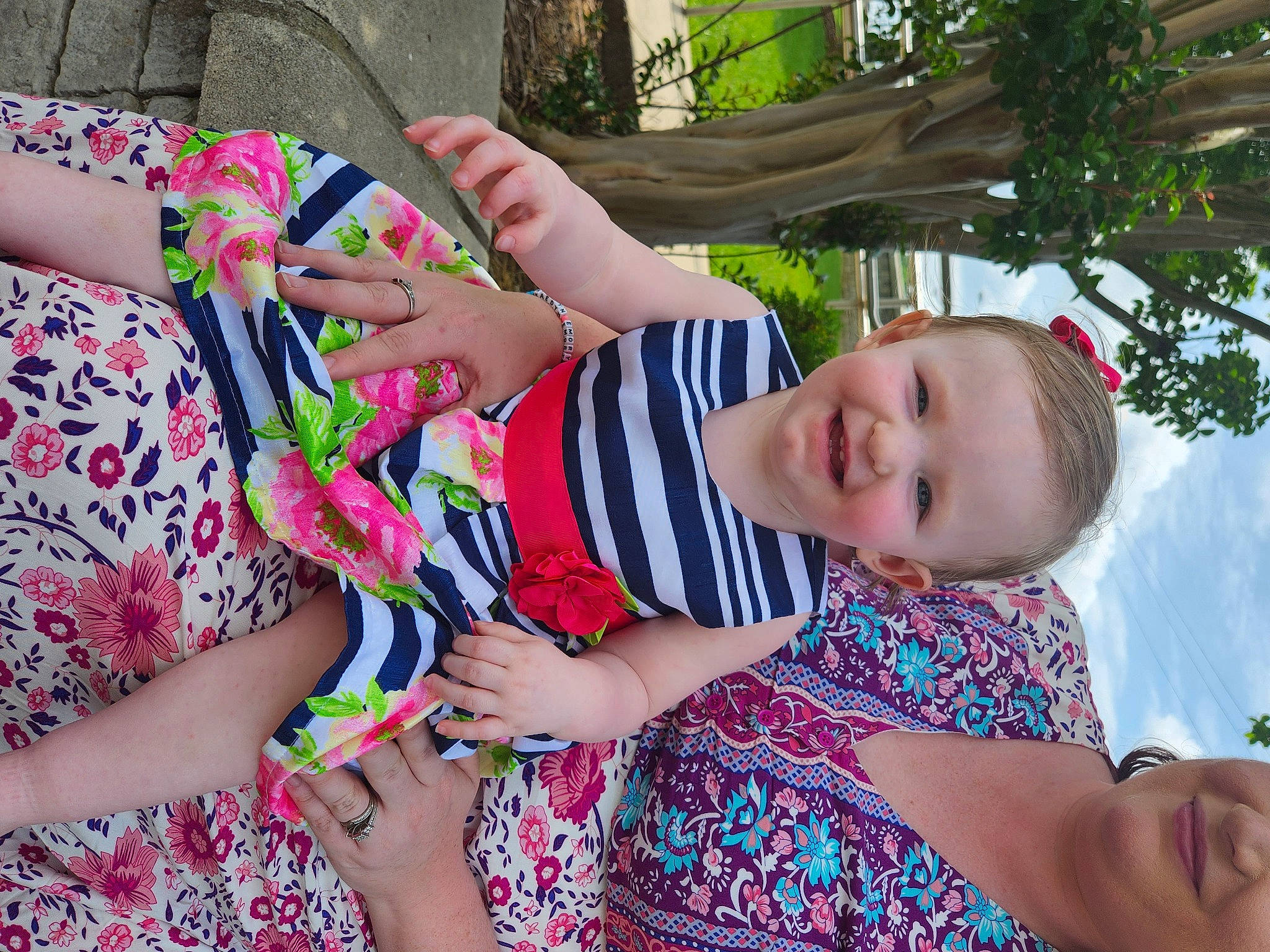 Emory is registered to the contest to win money with this photo: botany, child, facial_expression, finger, fun, gesture, grass, green, hairstyle, hand, happy, joy, leisure, people_in_nature, person, pink, plant, skin, smile, textile