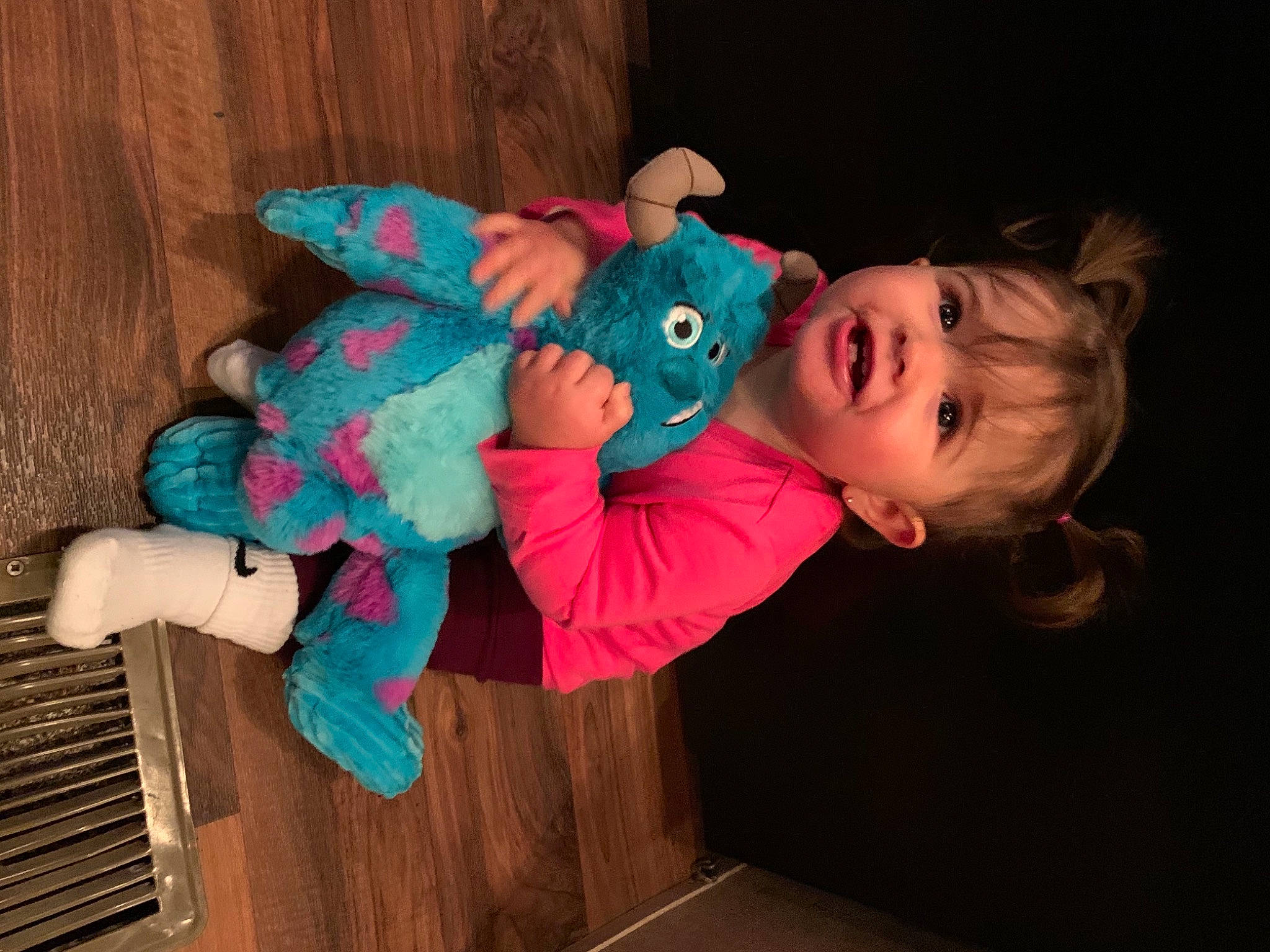 Juliette is registered to the contest to win money with this photo: arm, baby, baby_products, baby_toddler_clothing, baby_toys, cheek, child, costume, event, fun, happy, hardwood, person, pink, room, sitting, skin, stuffed_toy, toddler, toy