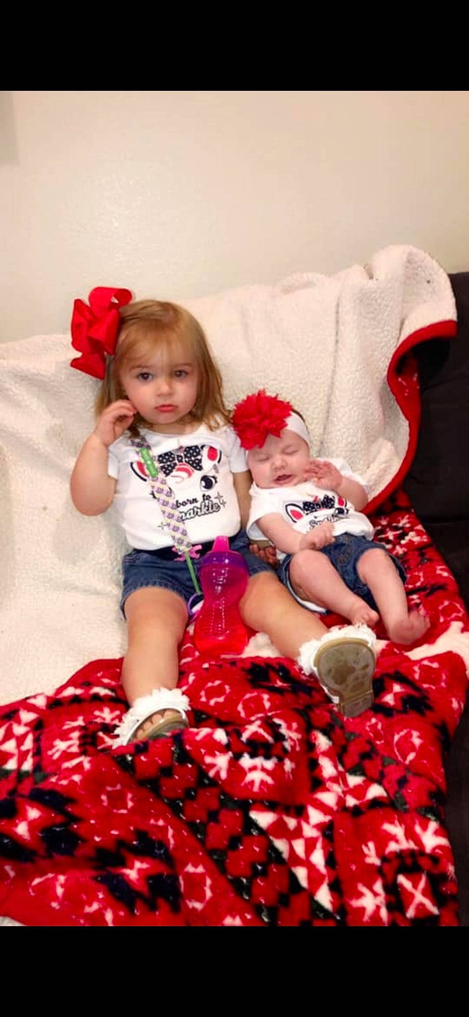 Ella is registered to the contest to win money with this photo: baby, baby_toddler_clothing, child, christmas, christmas_eve, dress, holiday, leg, pattern, person, plaid, play, red, sibling, sitting, toddler