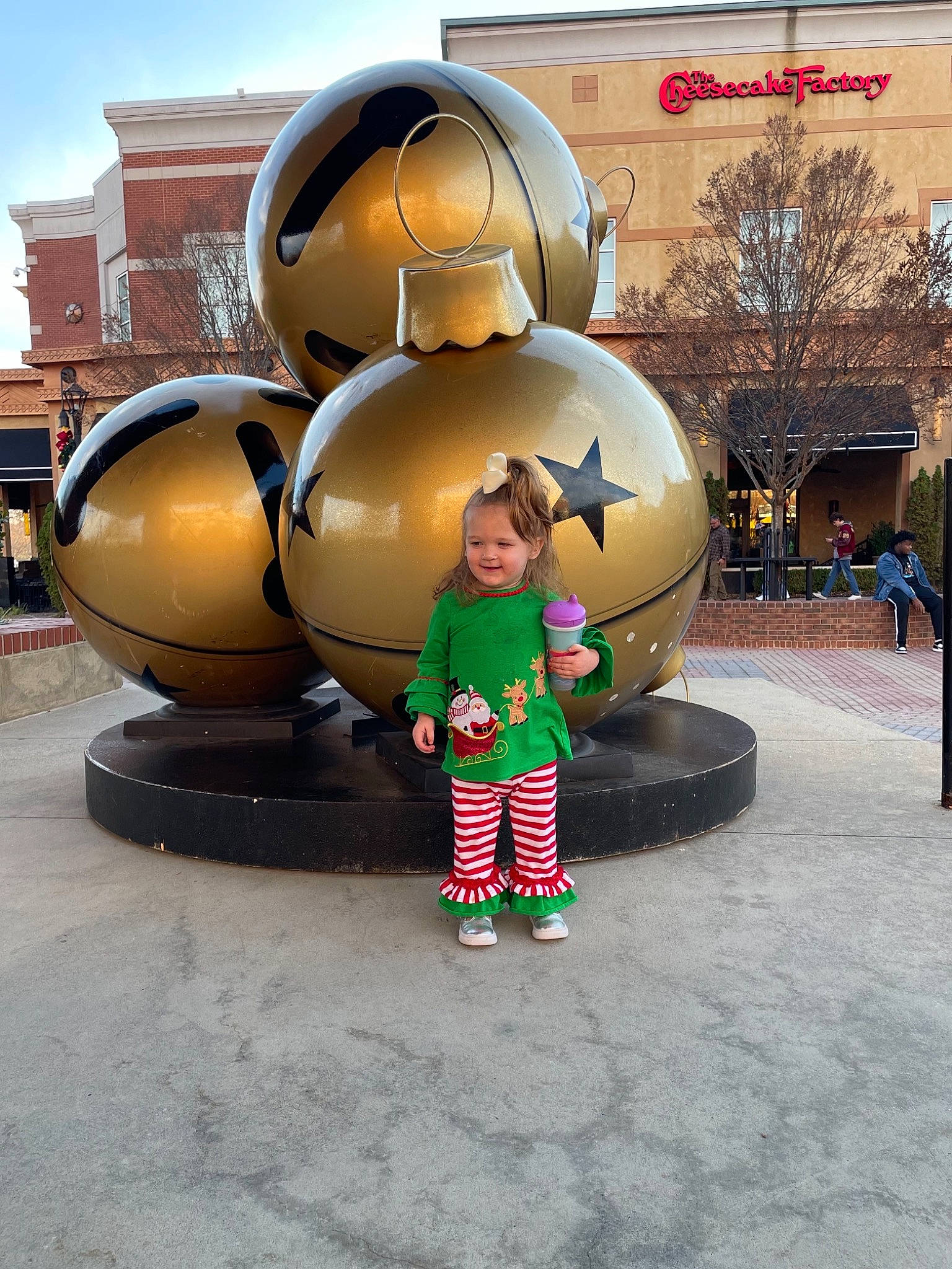 Lorelai is registered to the contest to win money with this photo: art, building, city, facade, fun, joy, leisure, pedestrian, person, recreation, sky, smile, street, temple, toddler, tourism, travel, tree, visual_arts, window