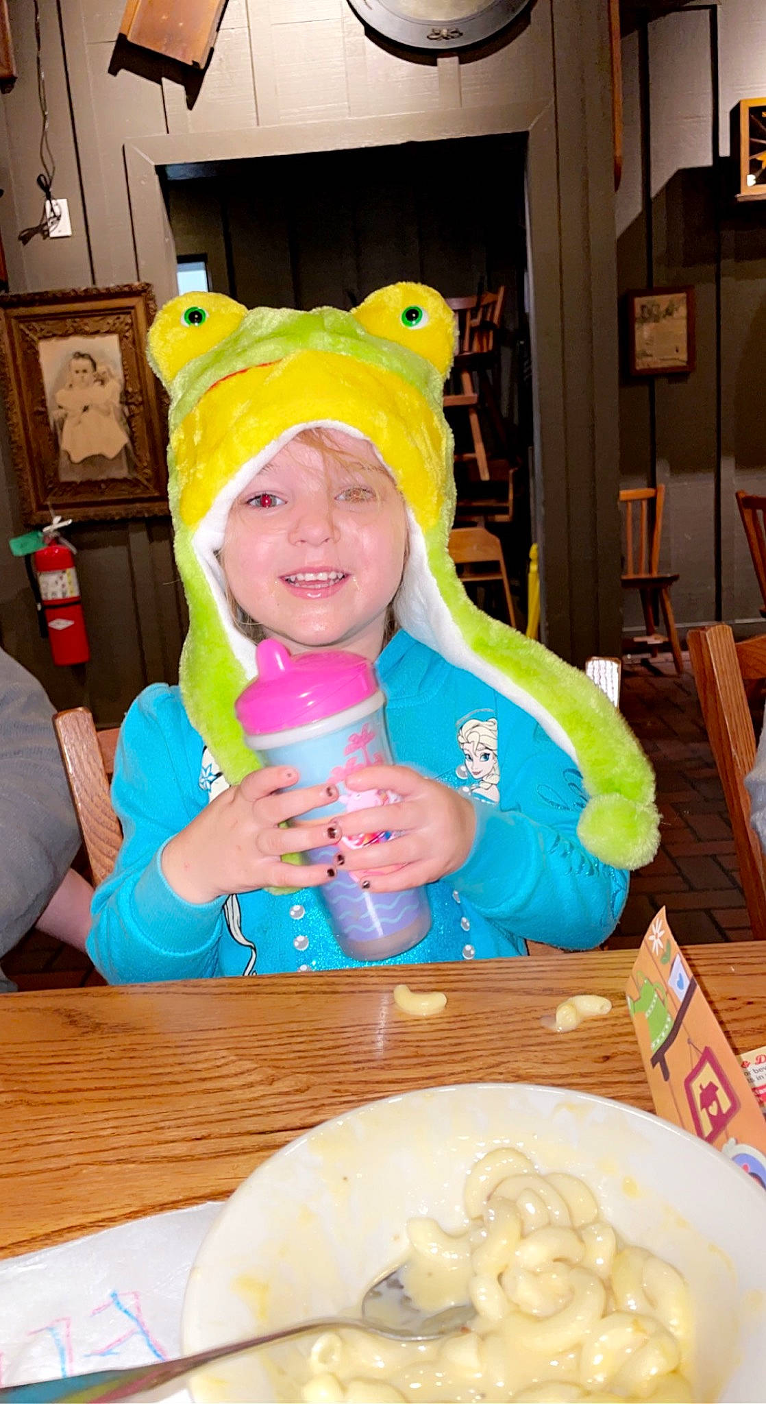 Ella is registered to the contest to win money with this photo: blurred, chair, child, comfort_food, cuisine, dish, dishware, event, food, fun, happy, headwear, ingredient, joy, person, personal_protective_equipment, plate, platter, smile, spoon