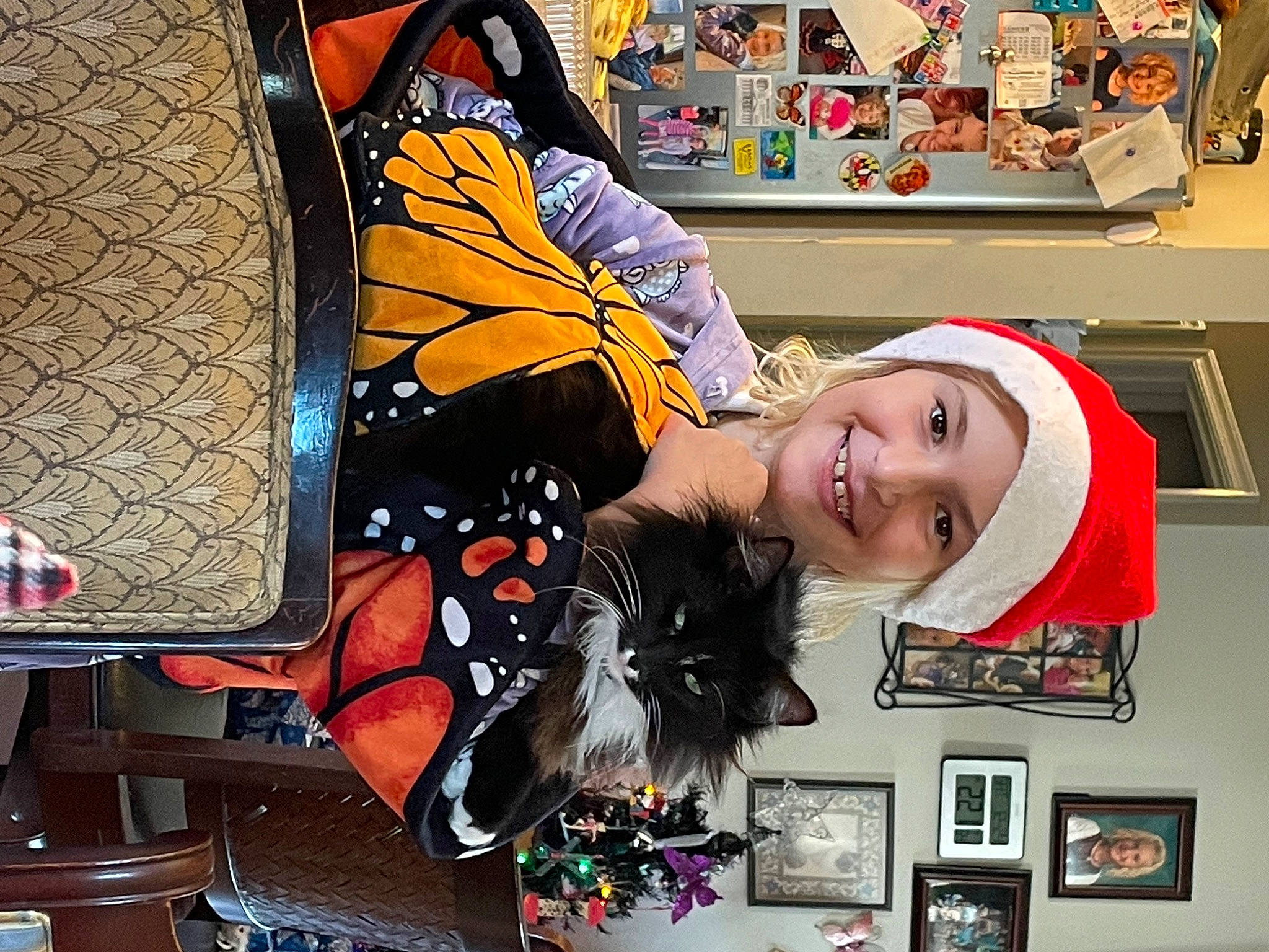 Oreo is registered to the contest to win money with this photo: art, costume, fashion_accessory, fun, hat, headgear, orange, personal_protective_equipment, picture_frame, room, smile, snapshot, visual_arts