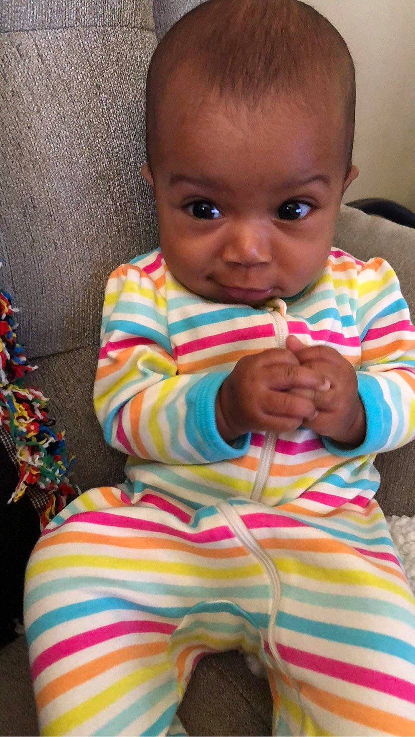 Mia joined the competition — help win amazing prizes! baby, baby_toddler_clothing, cheek, child, dress, eyelash, face, facial_expression, finger, hairstyle, happy, iris, lip, mouth, neck, nose, person, skin, sleeve, standing