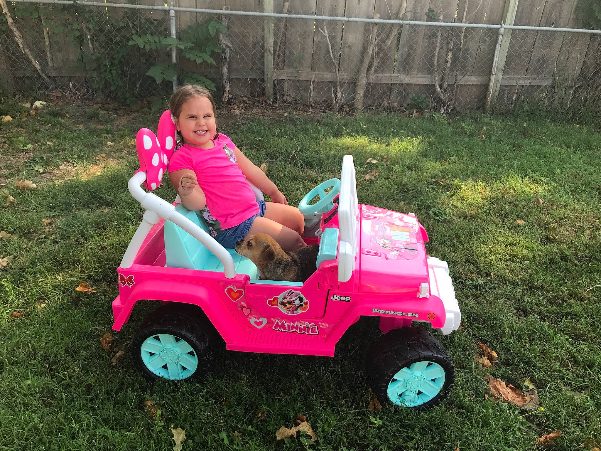 Adelyna is registered to the contest to win money with this photo: car, child, fun, grass, jeep, joy, lawn, person, pink, plant, play, riding_toy, toddler, toy, vehicle