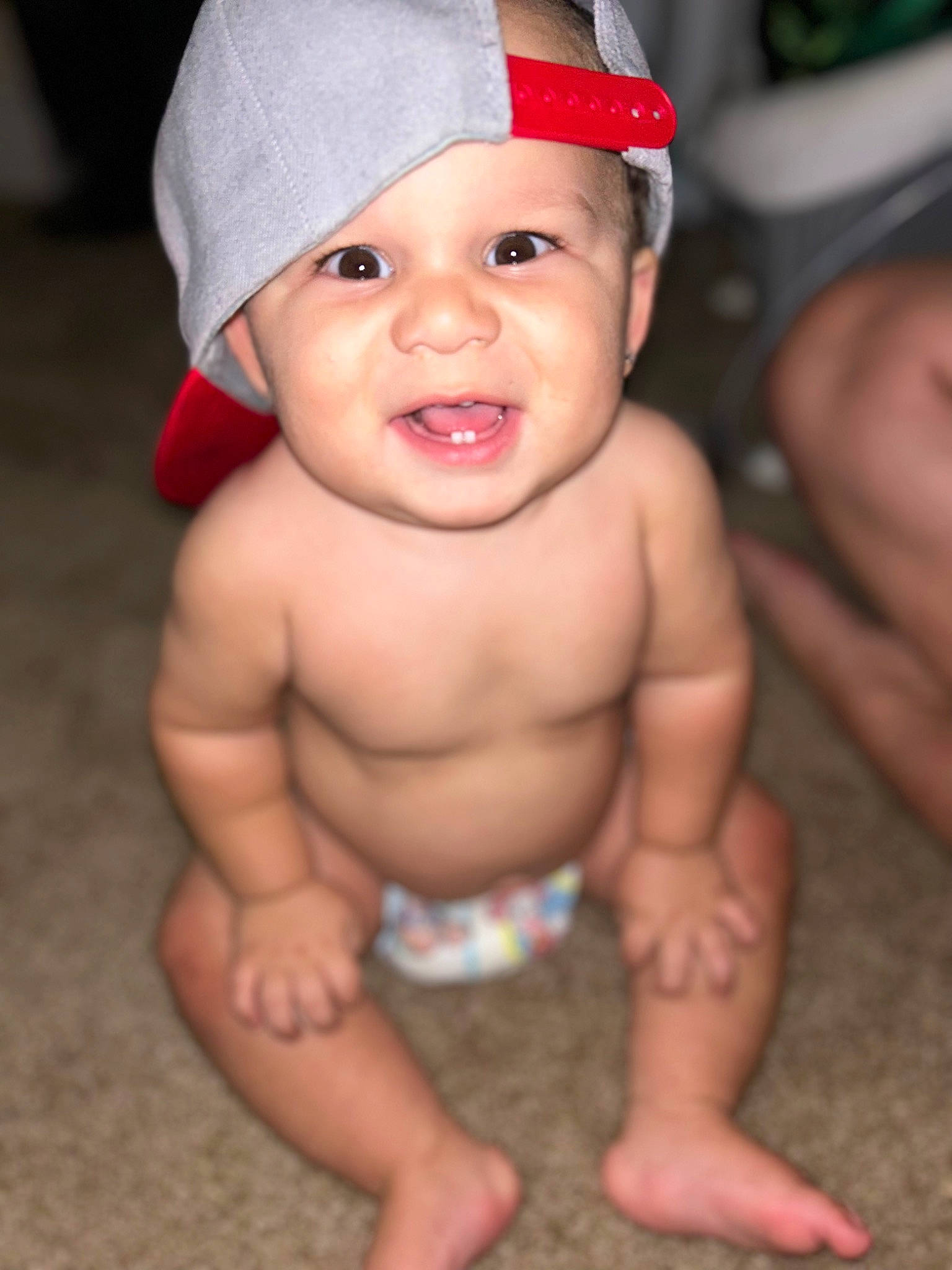 Jeremy is registered to the contest to win money with this photo: baby, baseball_cap, cap, chest, child, costume_hat, eye, eyebrow, fashion_accessory, finger, foot, fun, happy, headwear, human_body, lip, mouth, person, skin, smile