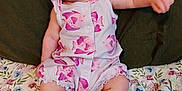 Laynie joined the competition — help win amazing prizes! baby, infant, romper, fish_pattern, floral_blanket, cushion, smile, cheeks, barefoot, skin, arm, leg, head, sitting, indoors, cute, child, person, clothing, fabric