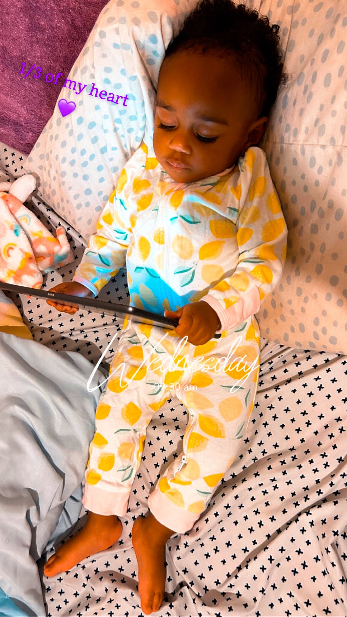 Imani is registered to the contest to win money with this photo: baby, baby_toddler_clothing, child, comfort, flooring, happy, linens, nightwear, orange, pajamas, pattern, person, pillow, play, room, sitting, sleeve, smile, textile, toddler