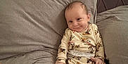 Luca-Lee joined the competition — help win amazing prizes! baby, bed, blanket, child, comfort, cute, foot, hand, headboard, indoors, infant, pajamas, person, pillow, portrait, relaxation, rest, sleepwear, smile, young