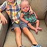 children, siblings, baby, toddler, boy, infant, portrait, smiling, sitting, sofa, couch, indoor, family, 兄弟, colorful_clothing, plaid_shirt, dress, shoes, casual, home