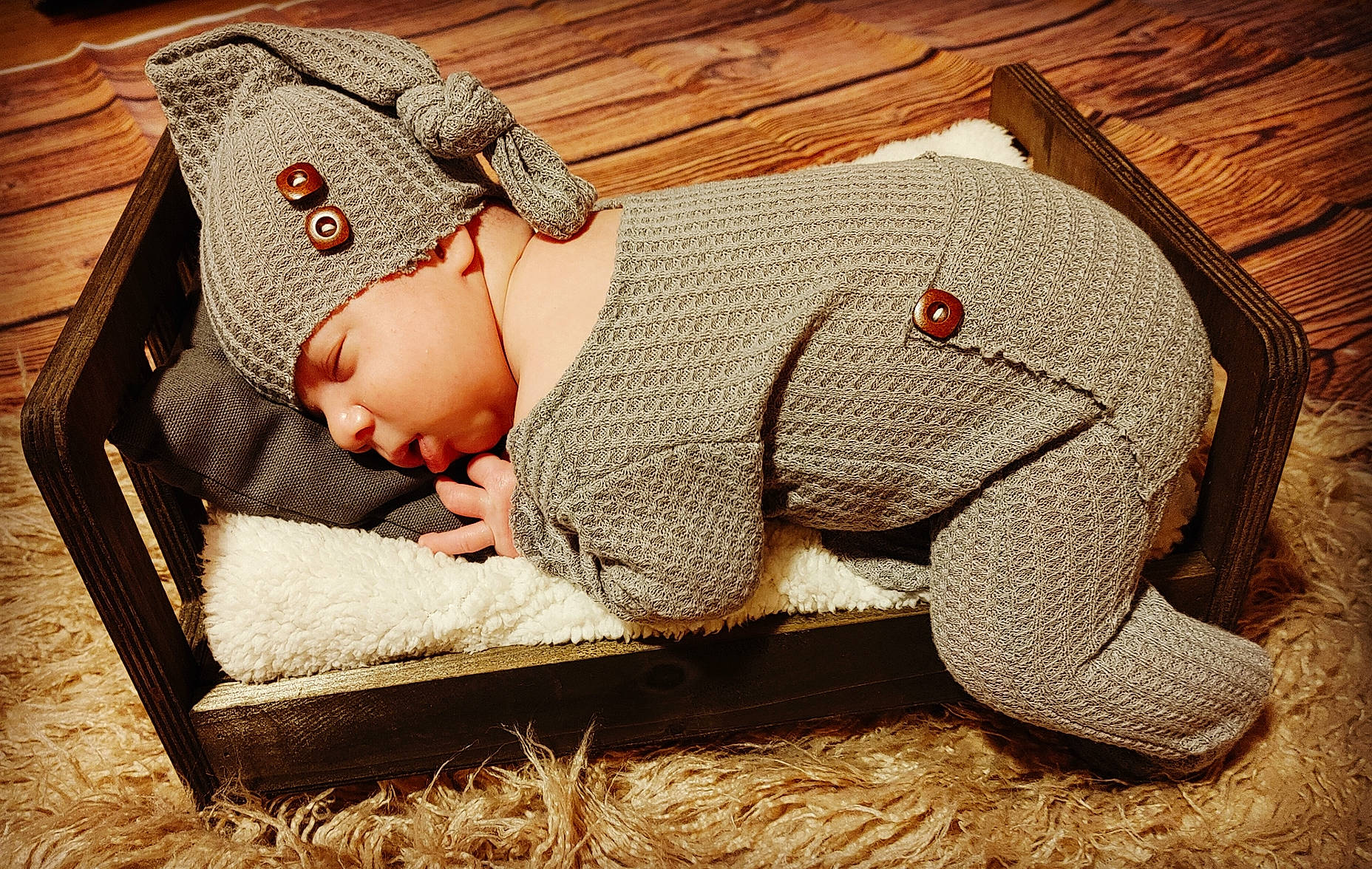 Brentlee joined the competition — help win amazing prizes! baby, baby_sleeping, baby_toddler_clothing, beanie, cap, carmine, comfort, fashion_accessory, fur, grass, hat, headwear, knit_cap, linens, pattern, person, sitting, sleeve, toddler, wood