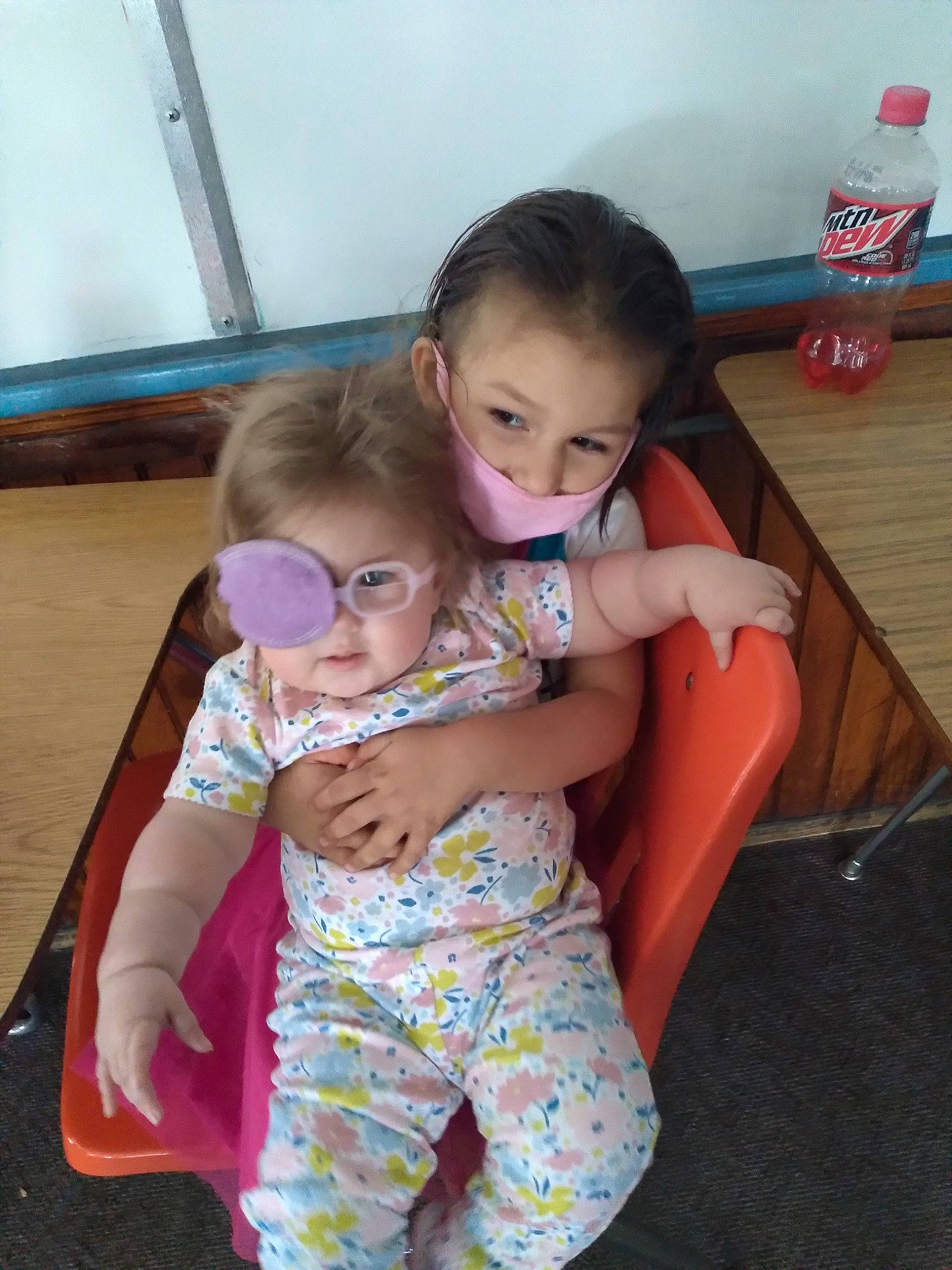 Adelina is registered to the contest to win money with this photo: baby, baby_toddler_clothing, chair, child, comfort, finger, flooring, fun, happy, iris, lap, leisure, mouth, nose, person, sitting, skin, t_shirt, tableware, thigh