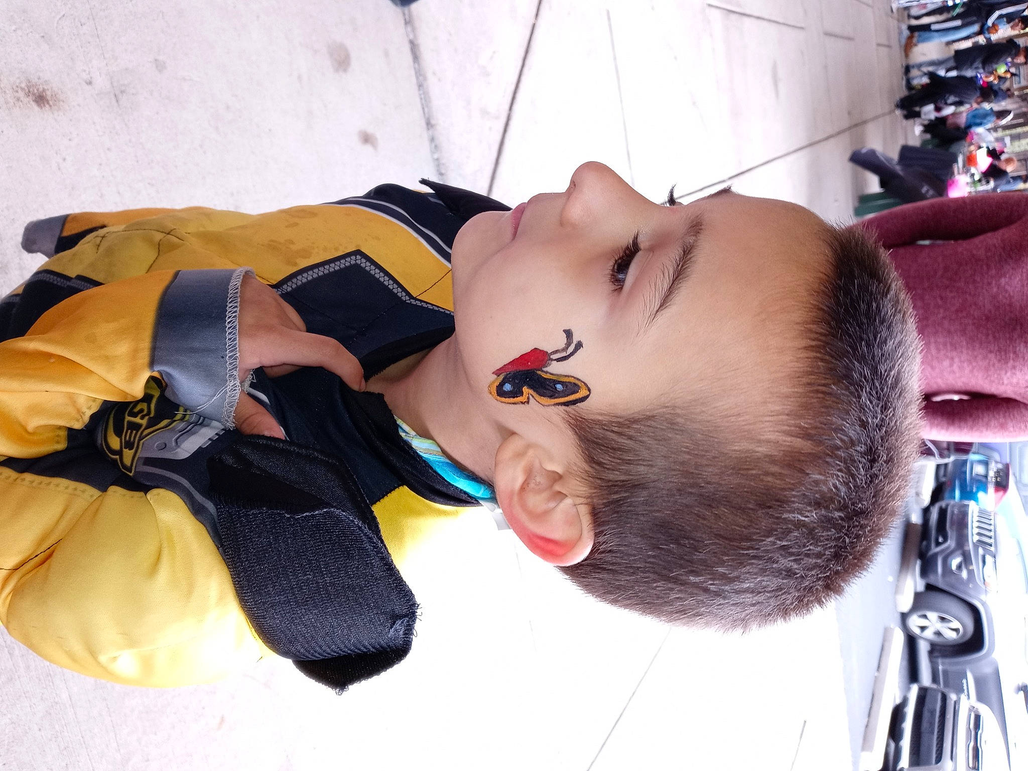 Lucas is registered to the contest to win money with this photo: automotive_design, beard, child, comfort, eyelash, eyewear, fun, fur, person, personal_protective_equipment, street_fashion, tire, vehicle, winter