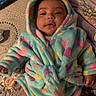 Violet is registered to the contest to win money with this photo: baby, blanket, clothing, coat, face, fashion, hat, head, hood, hoodie, jacket, knitwear, newborn, person, photography, portrait, quilt, sweater, sweatshirt, towel