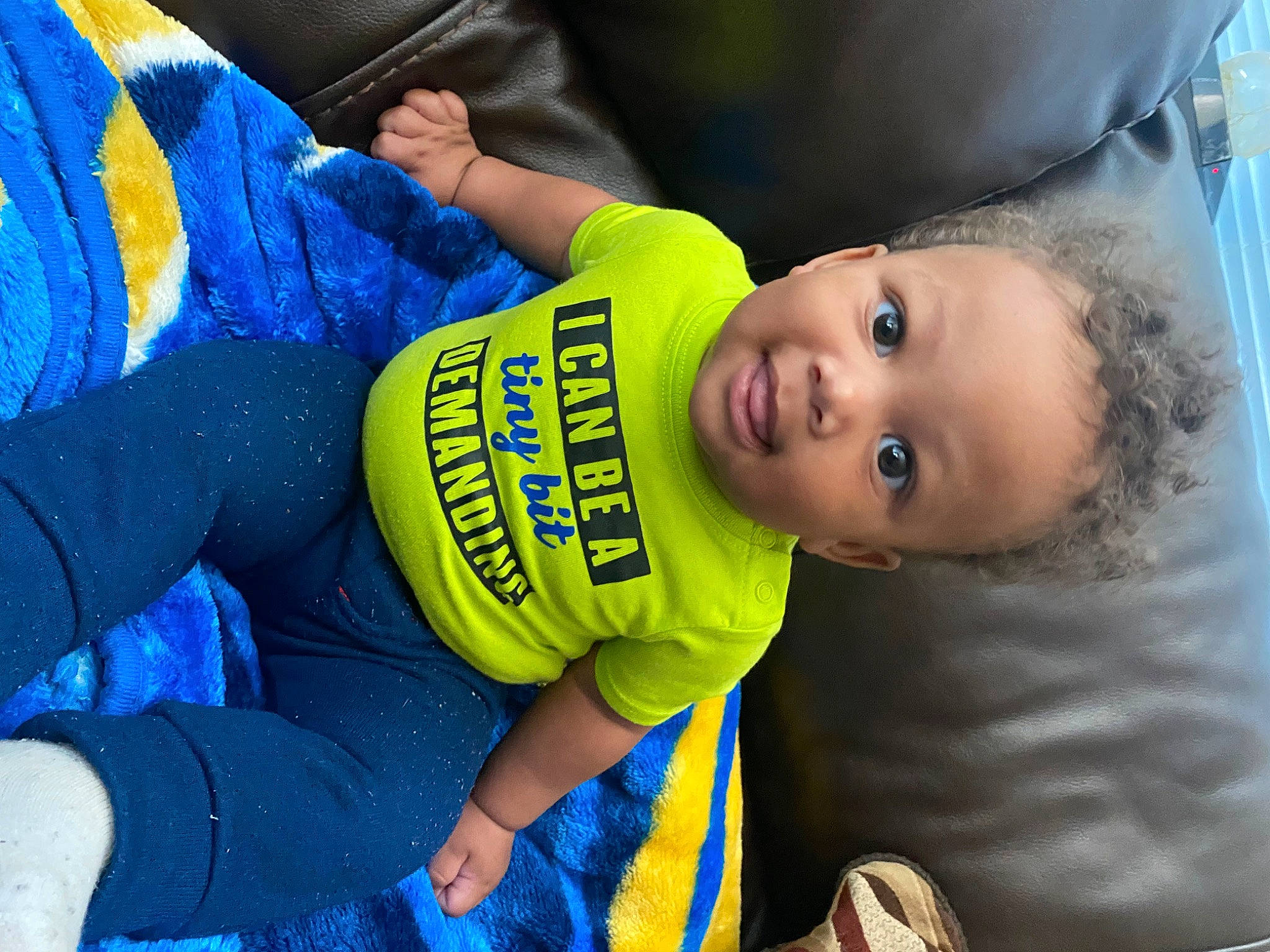Jeremiah joined the competition — help win amazing prizes! baby, baby_products, baby_toddler_clothing, blue, child, electric_blue, fun, grass, happy, leisure, person, personal_protective_equipment, sitting, sleeve, t_shirt, toddler