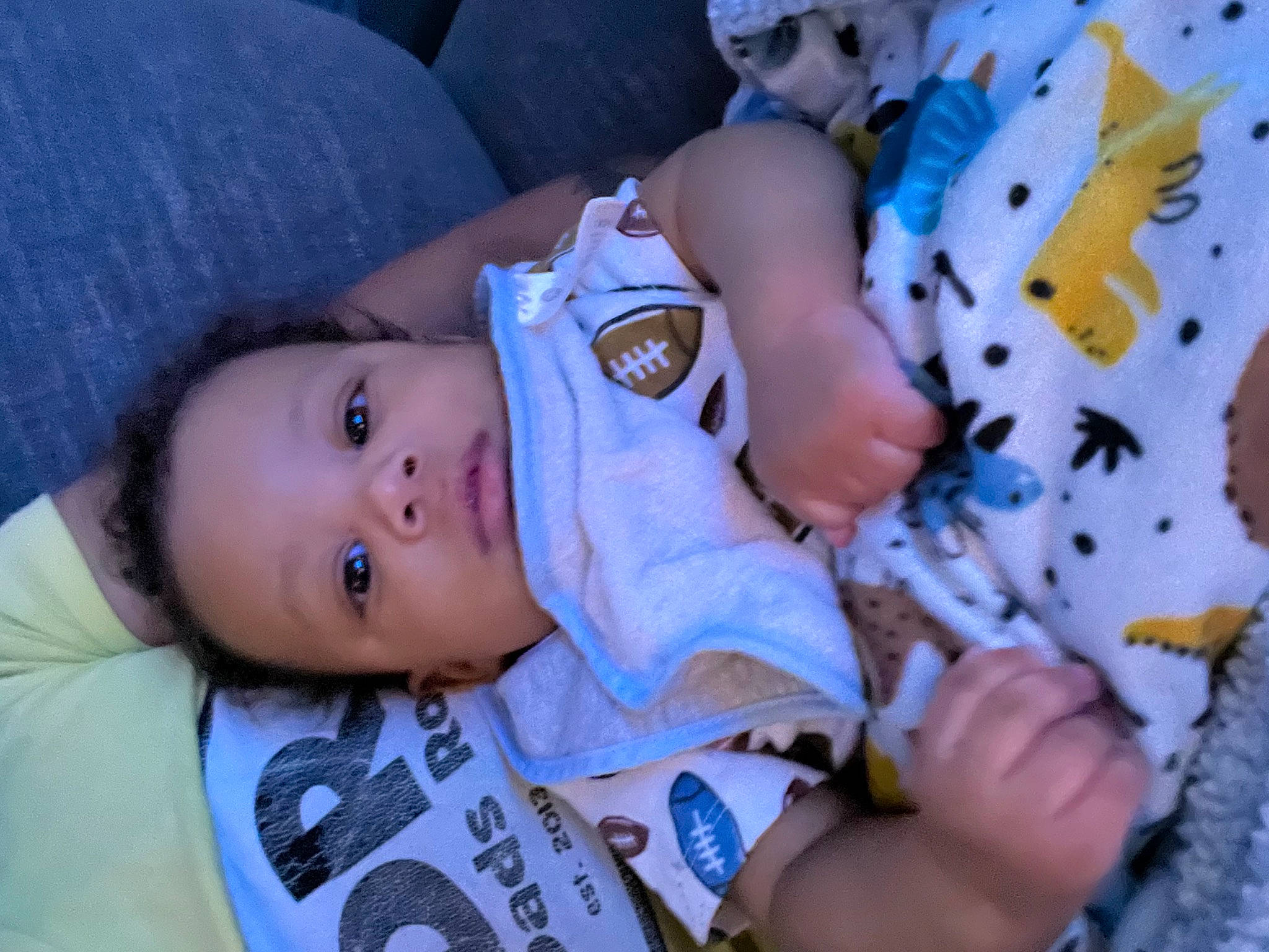 Jeremiah is registered to the contest to win money with this photo: baby, baby_products, baby_toddler_clothing, cheek, child, comfort, finger, grass, happy, hat, iris, nose, pattern, person, plant, sitting, skin, toddler, tree