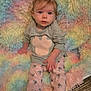 Brooklyn joined the competition — help win amazing prizes! baby, child, pigtails, pink_pants, gray_sweater, mouse_pattern, fluffy_blanket, rainbow_colors, floor, barefoot, sitting, curious_expression, indoors, soft_texture, young_child, cute, portrait, small_hands, cozy, casual_clothing