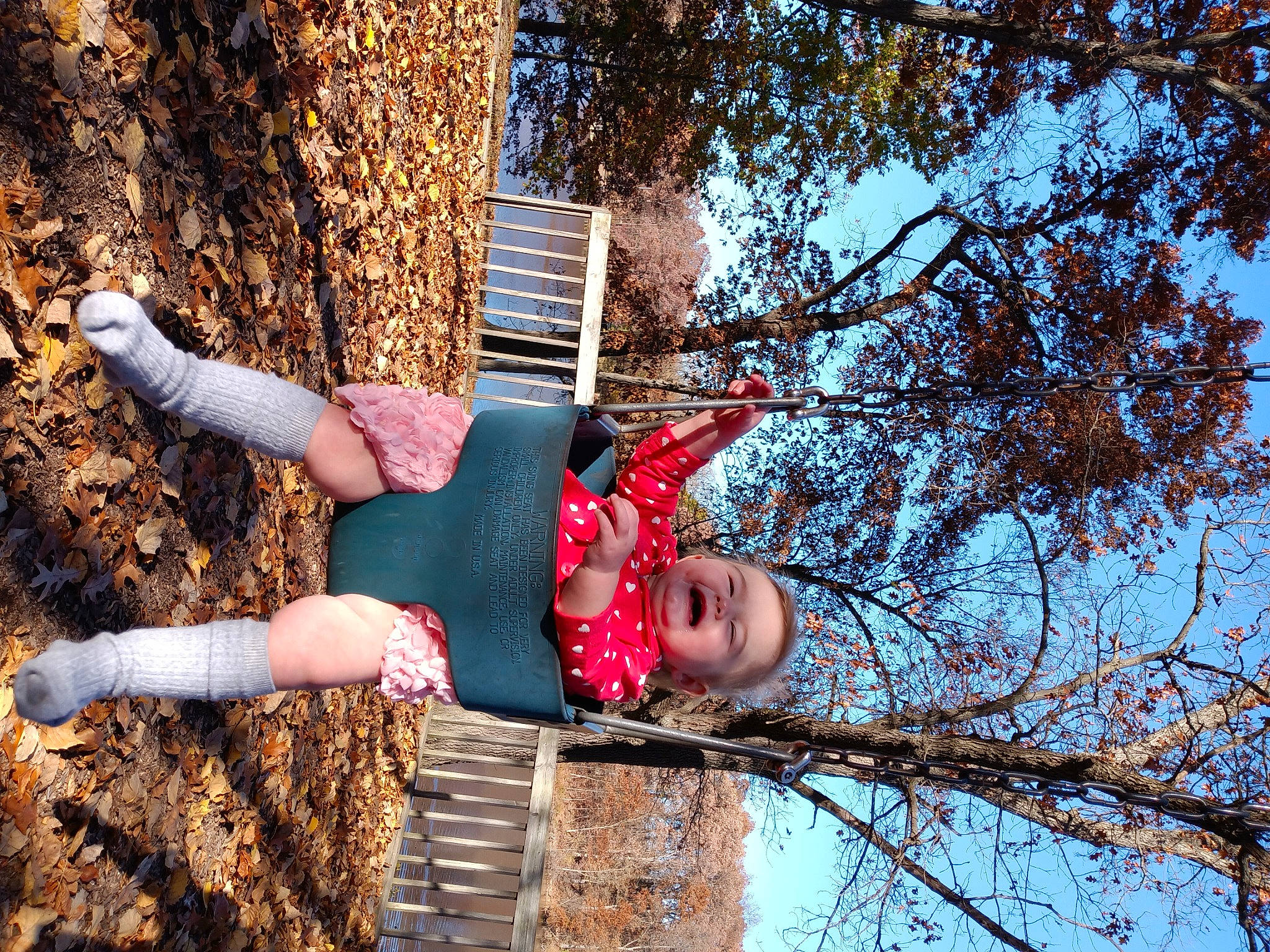 Jenevieve joined the competition — help win amazing prizes! autumn, boot, child, flash_photography, fun, grass, happy, human_leg, leisure, people_in_nature, person, plant, recreation, sitting, sky, soil, thigh, tree, trunk, twig