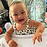 Aurorabelle joined the competition — help win amazing prizes! baby, bib, blue_eyes, brown_hair, child, close_up, cute, dress, hands, happy, high_chair, home, indoor, infant, parenting, patterned_clothing, portrait, seated, smiling, tray