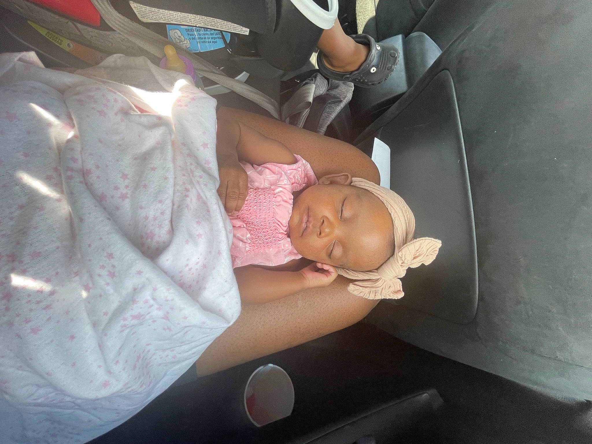 Amarah is registered to the contest to win money with this photo: auto_part, automotive_exterior, baby, baby_carriage, baby_products, baby_toddler_clothing, bumper, car_seat, child, comfort, dress, family_car, luxury_vehicle, motor_vehicle, nap, person, toddler, tree, trunk, vehicle_door