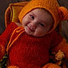 Hadryel participe au concours pour gagner de l'argent avec cette photo : baby, child, cozy, cute, happy, hat_with_ears, indoors, infant, knitted_hat, knitted_outfit, orange, playful, plush_toy, portrait, red, sitting, smiling, warm_colors, wicker_chair, wooden_floor