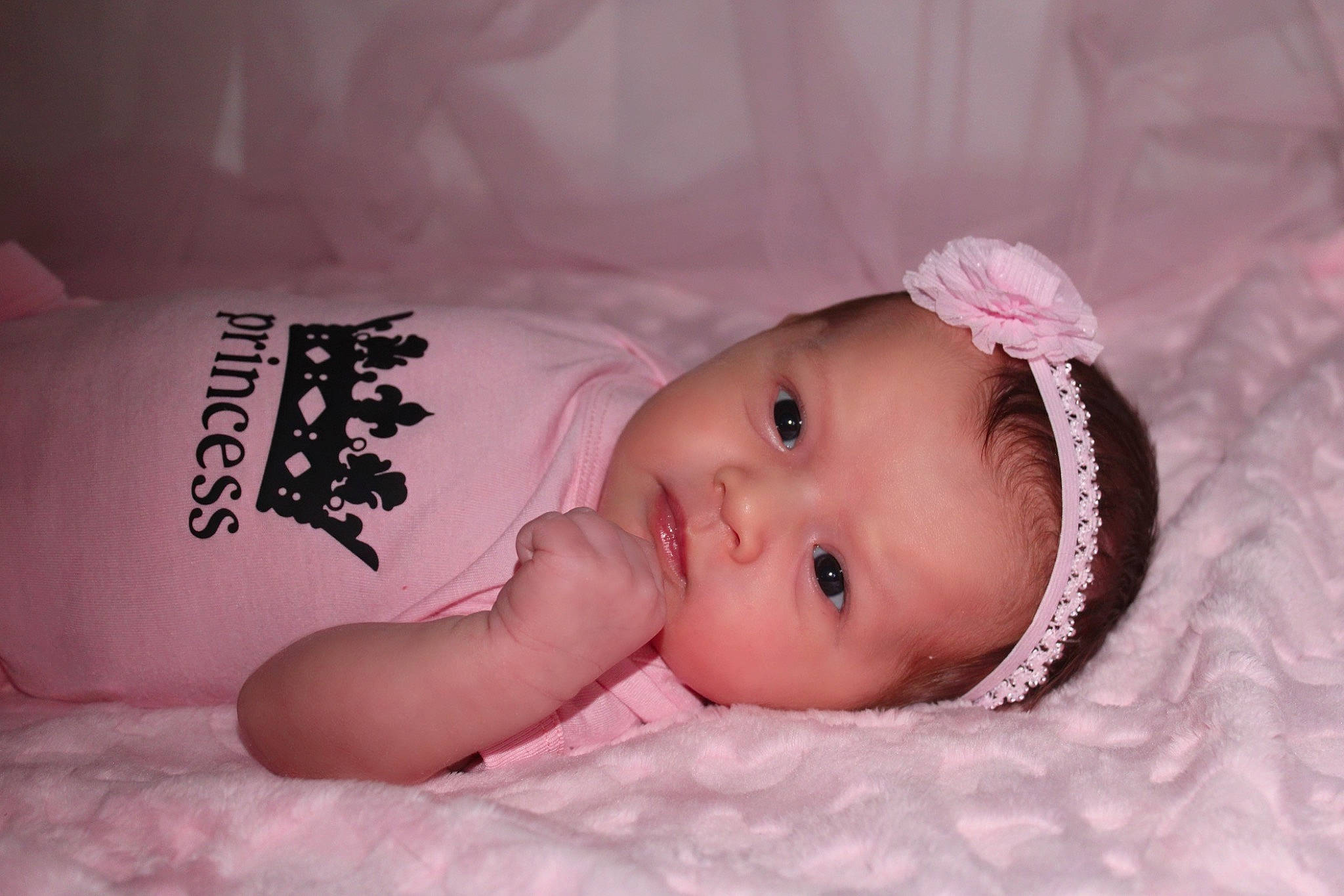 Mila is registered to the contest to win money with this photo: baby, baby_toddler_clothing, cheek, child, comfort, eye, eyebrow, face, fashion_accessory, flash_photography, happy, head, headgear, headwear, lip, person, pink, portrait_photography, room, skin