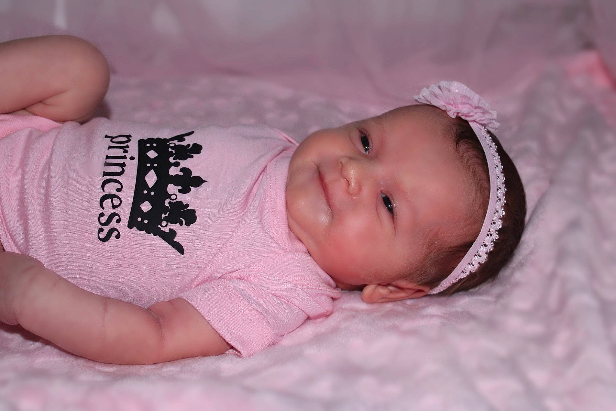 Mila joined the competition — help win amazing prizes! baby, baby_toddler_clothing, cheek, chest, child, comfort, elbow, eyelash, face, facial_expression, headgear, human_body, lip, mammal, mouth, person, pink, skin, sleeve, textile