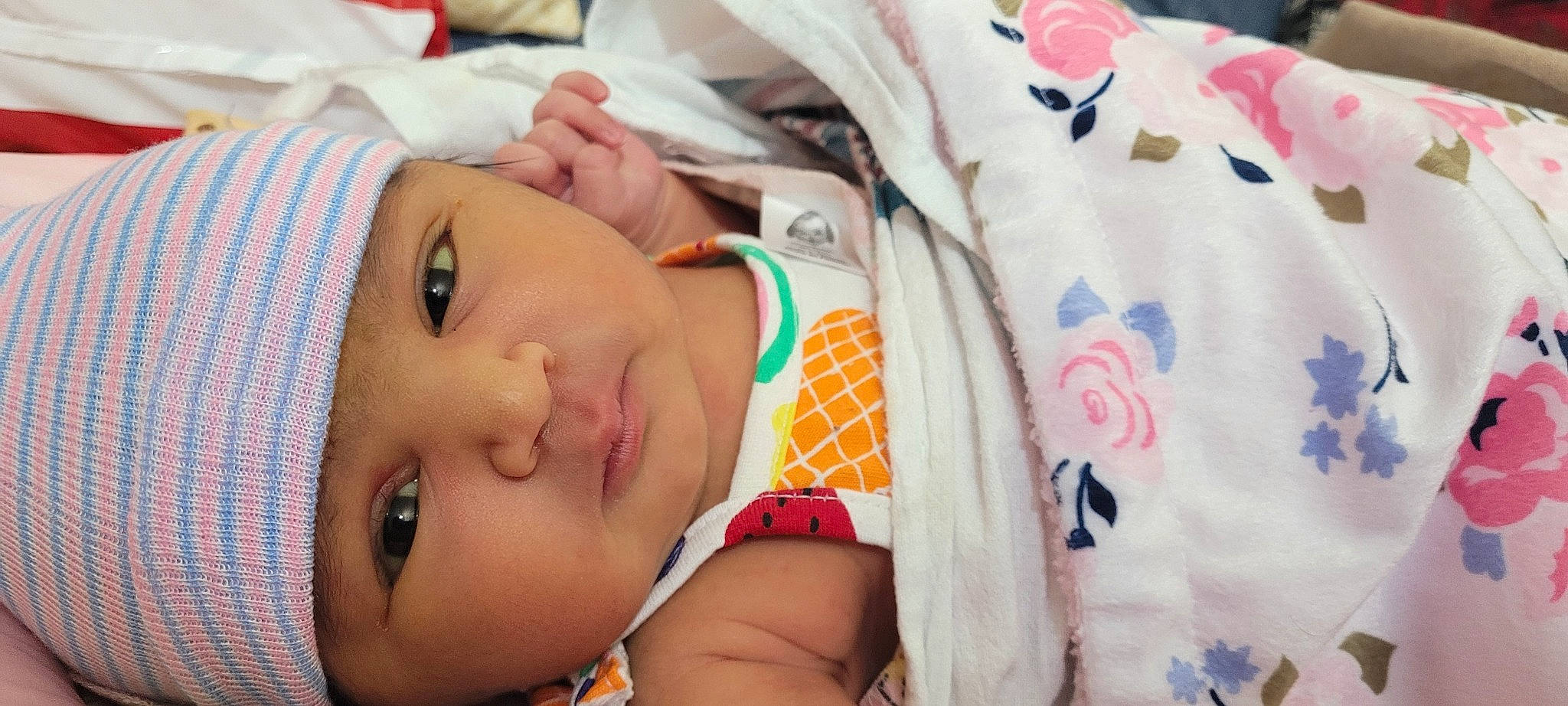 Rudri is registered to the contest to win money with this photo: baby, baby_toddler_clothing, cheek, child, comfort, eye, eyelash, face, finger, happy, headwear, iris, lip, mouth, neck, nose, pattern, person, product, skin