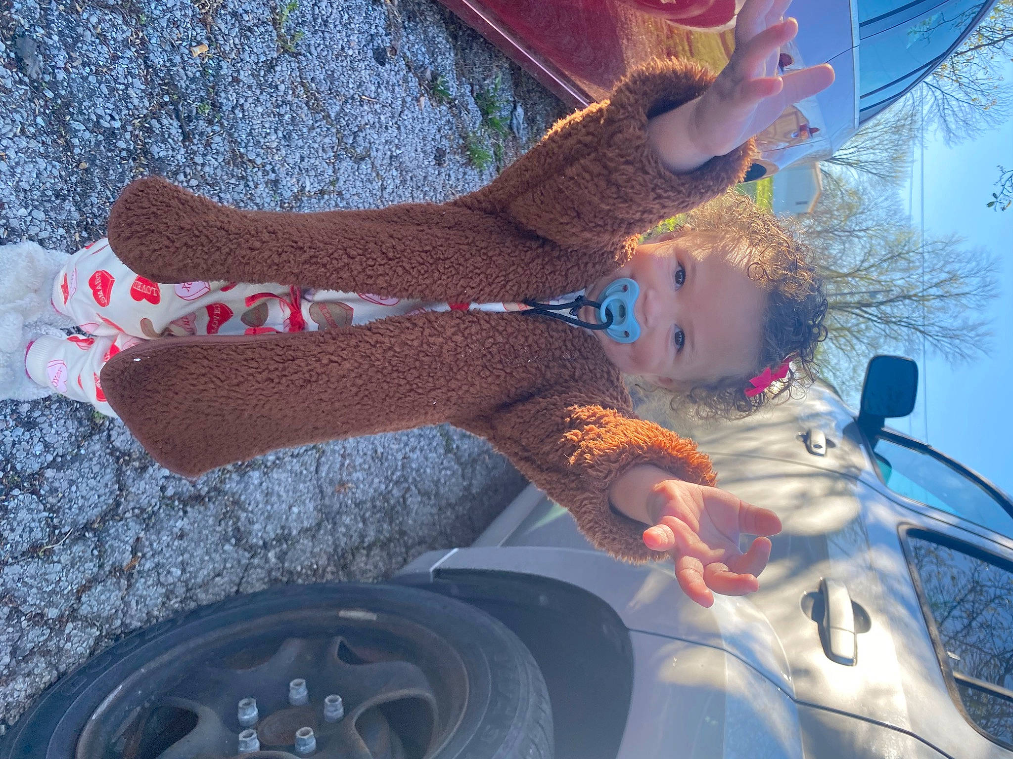 Jailyn is registered to the contest to win money with this photo: automotive_design, automotive_exterior, automotive_lighting, automotive_tire, automotive_wheel_system, bumper, car, electric_blue, finger, fun, hand, hood, human_leg, light, motor_vehicle, pattern, person, personal_luxury_car, thigh, tree